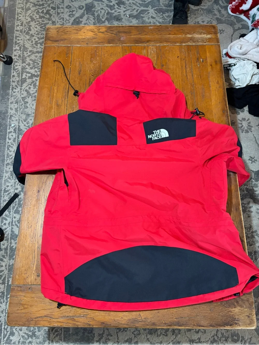 The North Face Red and Black Hooded Raincoat
